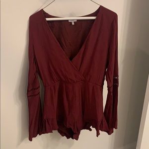 Wine colored long sleeve romper. Size medium